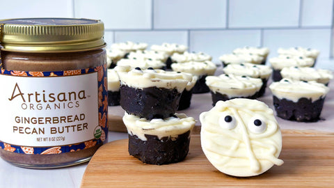 Mummy Rice Crispy Boo Treats with a jar of Artisana GIngerbread Pecan Butter