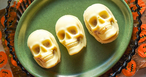 Three skulls made out of coconut and pecan butter