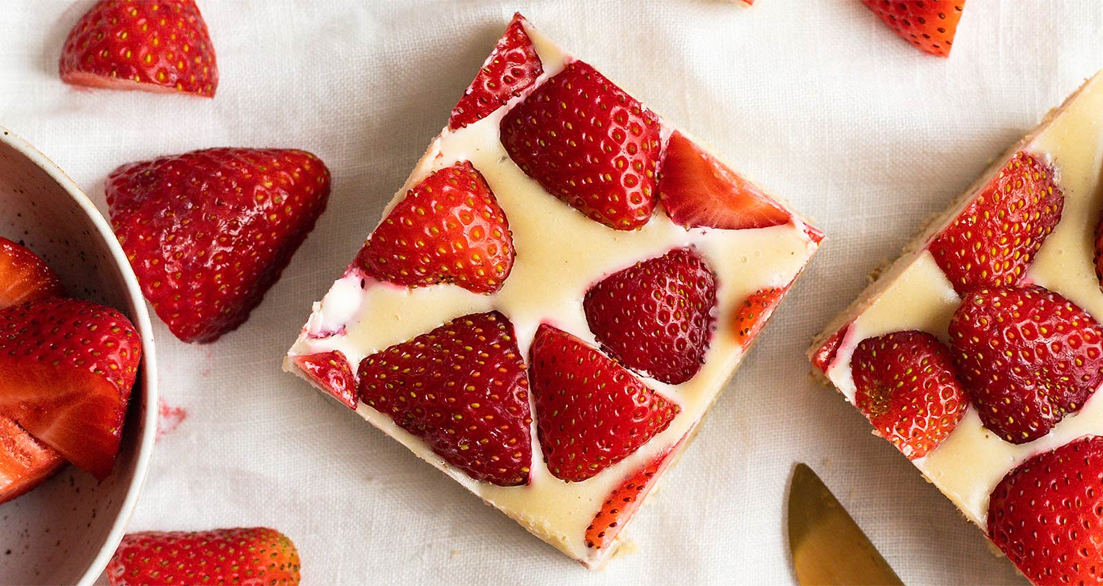 Strawberry cheesecake bars with lots of fresh strawberries