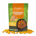 Artisana Organics Ginger Turmeric Pistachios pouch on white background with pistachios surrounding.