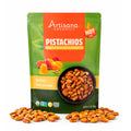 Artisana Organics Sweet & Spicy Honey Pistachios on a white background surrounded by pistachio nuts.