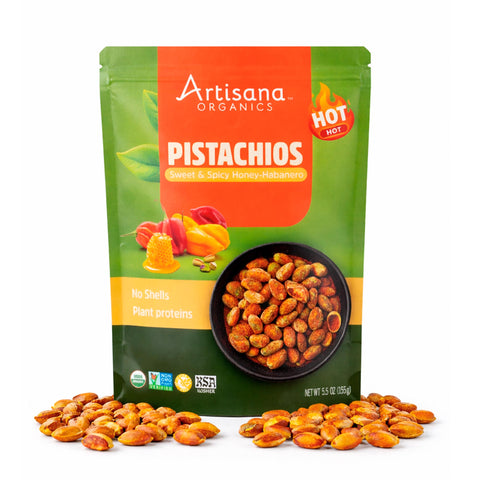 Artisana Organics Sweet & Spicy Honey Pistachios on a white background surrounded by pistachio nuts.