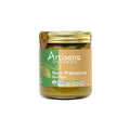 A glass jar of Artisana Organics Raw Pistachio Butter with a gold lid and a green and tan label, shown on a plain white background.