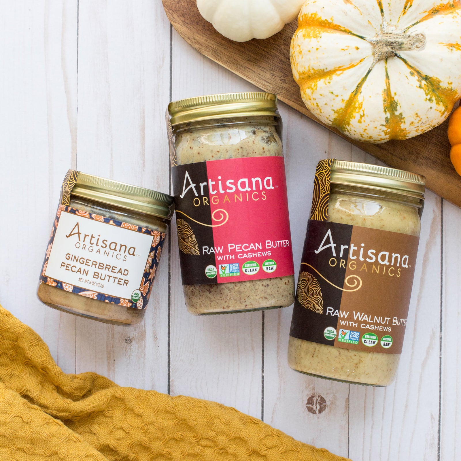 Jars of gingerbread pecan, pecan, and walnut butters