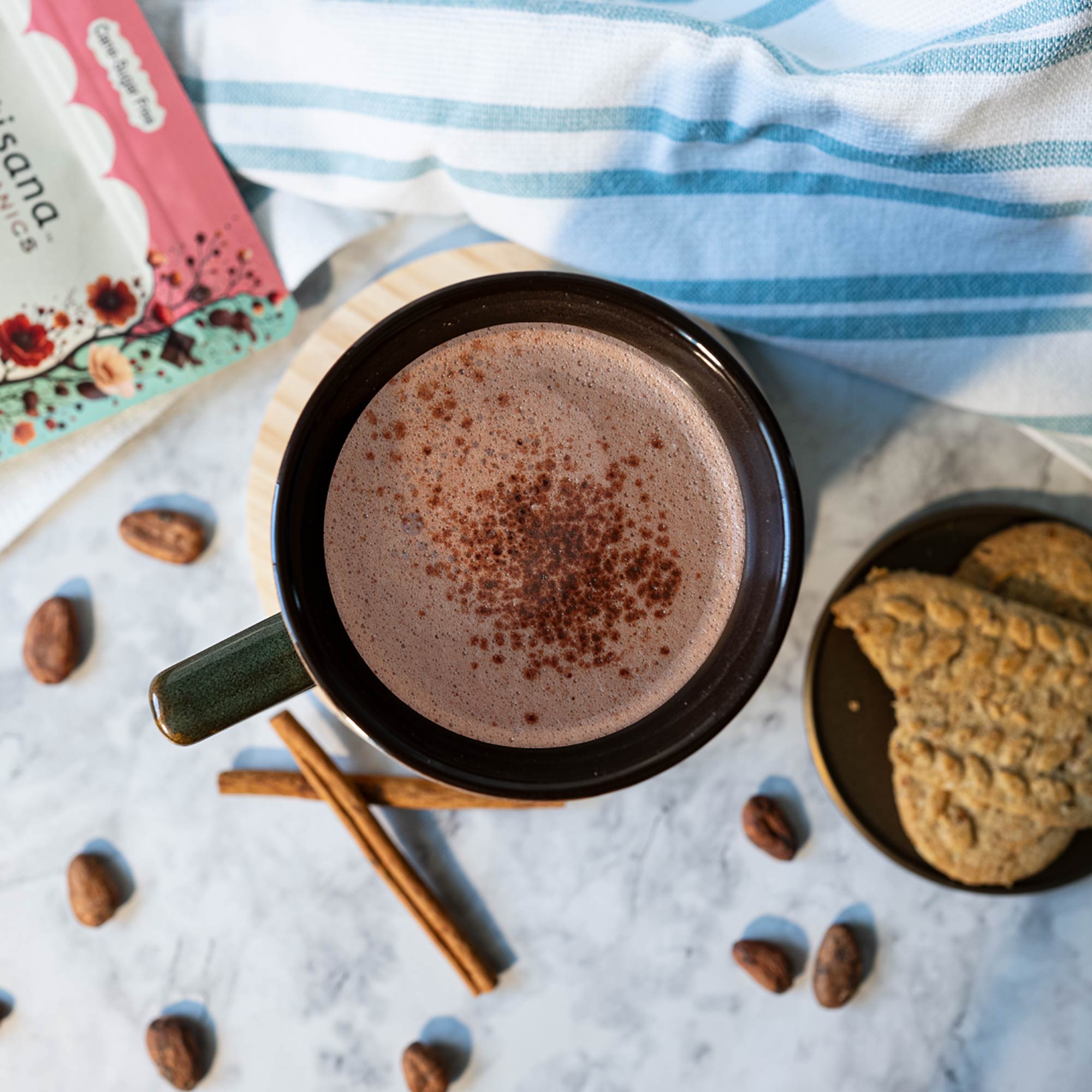 A mug of delicious hot chocolate with two cookies