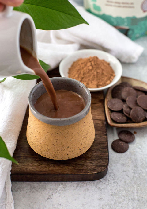 Hot chocolate poured into a mug.